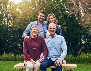 Wall Mural - Always try to spend as much time with your parents. Shot of a family outside.