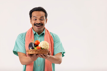 Wall Mural - Portrait of a happy cook servant with vegetable basket