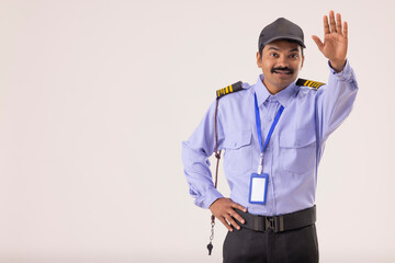 Wall Mural - Portrait of Security guard gesturing with his palm