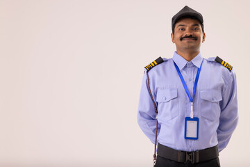 Wall Mural - Portrait of Security guard posing with hands behind back