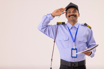 Wall Mural - Portrait of a male security guard saluting