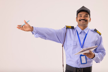 Wall Mural - Portrait of security guard pointing away with his hand