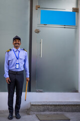 Wall Mural - Security guard working in front of gate