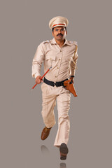 Wall Mural - Portrait of an Indian policeman running