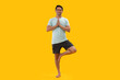 © IndiaPix - Portrait of a young man practicing yoga