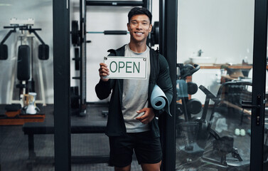 Aufkleber - Youre welcome any time between 9 and 5. Cropped portrait of a handsome young male fitness instructor holding up a sign that says OPEN while standing in a gym.