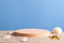 Empty Round Beige Platform Podium With Sea Shells And Starfish On White Beach Sand Background. Minimal Creative Composition Background For Cosmetics Or Products Presentation. Front View