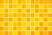 Yellow Ceramic Wall And Floor Tile Abstract Background. Design Geometric Orange Mosaic Texture Decoration Of The Bedroom. Simple Seamless Pattern Grid For Backdrop Hospital Wall, Canteen And Kitchen.