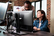 © DC Studio - Confident man pointing out mistakes in design blueprint while having conversation with colleague. Creative company digital designer signaling faulty graphic software while in office workspace.