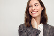 © Martin Villadsen - Close-up portrait of beautiful young businesswoman looking happy and confident to the left. Big smile on her face, looking beautiful and cheerful standing isolated on white background.