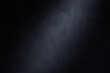 © OneClic - Dark photography backdrop. Concrete wall texture with lighting effect background.