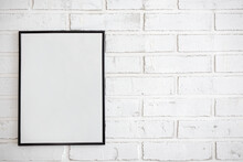 Mock Up Poster Frame Over White Brick Wall Background