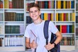 © Valerii Honcharuk - Portrait of male teenage student looking into the camera in library