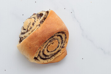 Wall Mural - Homemade poppy seed roll buns on a white table