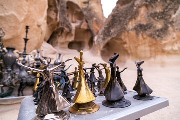 Wall Mural - Fairy tale chimneys in Cappadocia with blue sky on background in Goreme,Nevsehir, Turkey. Volcanic rock landscape, Stone houses. 