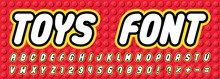Toys Font On Red Brick Block Toy Background Like Lego. Letters And Numbers For Kids. Design For Children's Party, Sale Promotion, Toy Shop, Poster, Banner, Logo, Advertisement. Vector Illustration