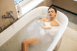 © zinkevych - Beautiful calm woman dozing in the bath
