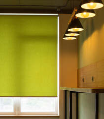Poster - Roller blinds closeup on the window in the interior. Roller shades for big windows. Automated curtains for office. Green color, monochrome material. Window coverings.