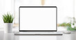 Leinwandbild Motiv Laptop with blank screen on tabl .in bright livingroom - home office background