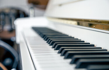 Wall Mural - Close-up of white piano keys, musical background.