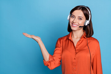 Wall Mural - portrait of attractive cheerful girl help desk service specialist holding copy space isolated over b