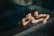© BGStock72 - Young couple relaxing in a swimming pool