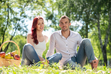 Wall Mural - Couple on a picnic in the park