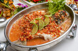 A Spicy Sea Bass with Chopped Peppers in Thai Sauce