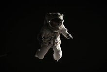 Full Portrait Of Caucasian Female Astronaut During Spacewalk, Black Deep Space Background