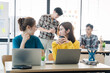 © Daenin - Young colleagues having great business conversations in a modern coworking office. Teamwork concept. Horizontal blurry background. Fireworks.