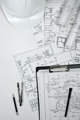 Wall Mural - architect design working drawing sketch plans blueprints and making architectural construction model in architect studio long banner