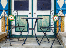 Table And Chairs At A Sidewalk Cafe
