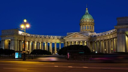 Poster - St Petersburg, Russia. Illuminated Cathedral of Our Lady of Kazan, Russian Orthodox Church in Saint Petersburg, Russia at night with car traffic trail light at the forefront. Time-lapse, panning video