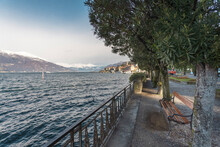 Italy, Bellagio, Bench On Promenade By Lake Como
