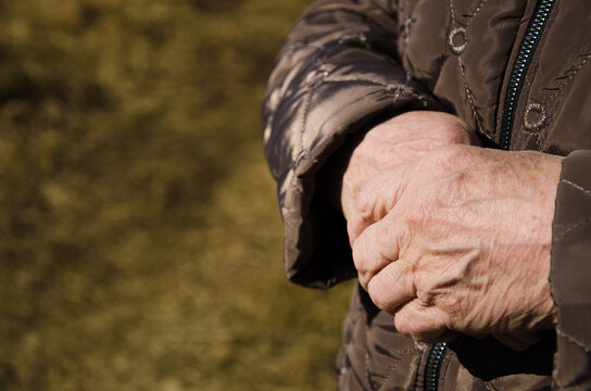 Grandma's wrinkled hands. the concept of pensioners and helping old people. space for text