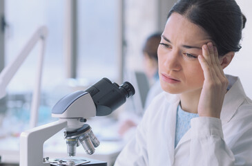 Wall Mural - Young researcher having a headache