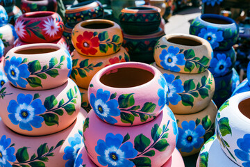 Wall Mural - Variety of Colorfully Mexican Painted Ceramic Pots in an Outdoor Shopping Souvenir Market in Mexico.