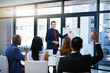 © Thurstan Hinrichsen/peopleimages.com - Hes always open to questions. Shot of a young businessman giving a demonstration on a white board to his colleagues in a modern office.
