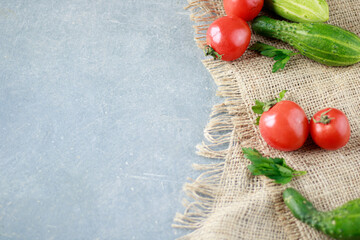 Wall Mural - Italian food background on rustic wooden boards with copy space, with tomatoes, cucumbers and spices