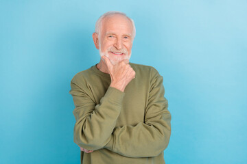 Poster - Portrait of attractive cheerful content grey-haired man touching chin thinking isolated over bright blue color background