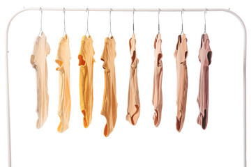 Rack with baby bodysuits on white background