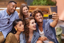 All Aboard The Selfie Express. A Group Shot Of University Students Having Fun At Campus.