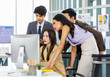 © Bangkok Click Studio - Asian male female professional businessman businesswoman colleagues in formal business suit helping teaching job task to new recruitment employee staff online via computer in company office workplace