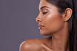 © Tasneem H/peopleimages.com - I guess beauty does have a best side. Cropped shot of a beautiful young woman posing in the studio.