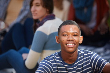 Poster - Living that college life. Cropped portrait of a happy young man relaxing outside on campus.