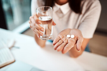 Poster - These will combat my symptoms. Closeup shot of an unrecognisable businesswoman holding a glass of water and medication in an office.