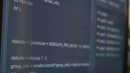 closeup of computer screen of system engineer typing source code in it startup agency. display conce