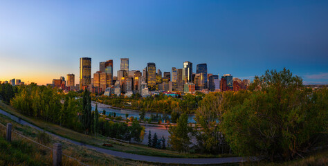 Wall Mural - Sunset above city skyline of Calgary with Bow River, Canada