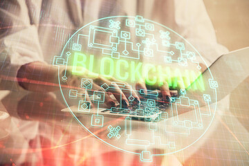 Poster - Double exposure of woman hands typing on computer and crypto market theme hologram drawing. Blockchain concept.
