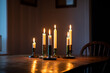 © Johnér - Lit candles on wooden table